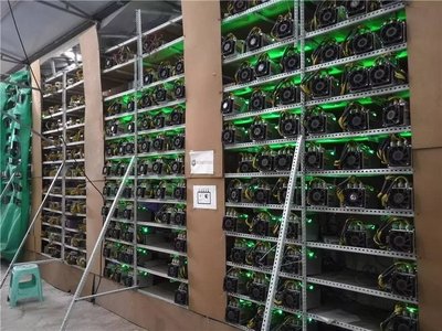 A large mining farm with numerous mining rigs operating